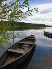 Old wooden boat on the river Bank