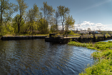 Fototapeta premium View of the Peter's locks and the historic old Ladoga canal for the construction of merchant ships in the city of New Ladoga.