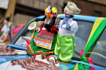 Wedding Car Decorations. Ukrainian doll-motanka or rag doll. Handmade textile doll ancient culture folk crafts tradition of Ukraine. Yarn. Folk doll. Motanka. Wedding dolls on the Car "Zaporozhets"