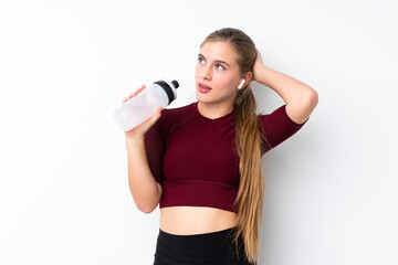 Sport teenager girl over isolated white background with sports water bottle