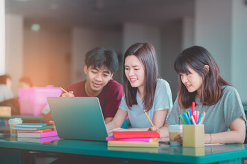 Teenage students are using computers for education via the Internet, Communication system education happy.