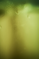 green steam condensation on a glass - freshness abstract background
