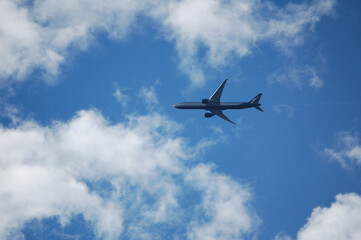 Fototapeta na wymiar airplane on the cloudy sky