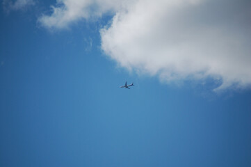 airplane on the cloudy sky