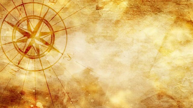 Old compass on the vintage paper background