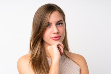 Fototapeta premium Portrait of beautiful teenager blonde girl over isolated white background