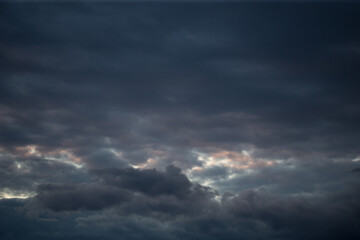 Fototapeta premium Fluffy clouds cover the summer blue sky