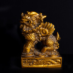 Golden chinese ornament on a black background