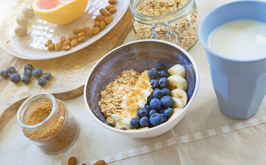 Healthy breakfast with berries, yogurt and oat flakes.