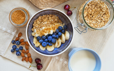 Healthy breakfast with berries, yogurt and oat flakes.