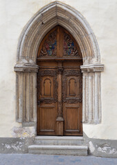 Ornate wooden door and stone archway 