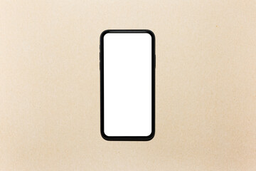 Top view close-up of modern smartphone with empty white mockup on screen. Isolated on background of beige or cardboard color.