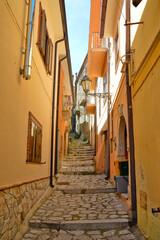Fototapeta na wymiar A street between the old houses of a medieval town of Montefalcione in the Irpinia region.