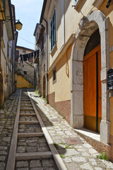 Fototapeta na wymiar A street between the old houses of a medieval town of Montefalcione in the Irpinia region.