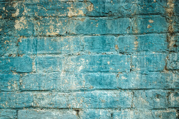 Old cracked  brick wall	 with blue peeling paint