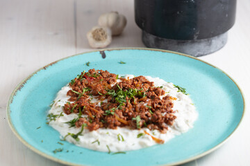 Turkish and Arabic Traditional Ramadan Kebab Ali Nazik on white rustic wood background.