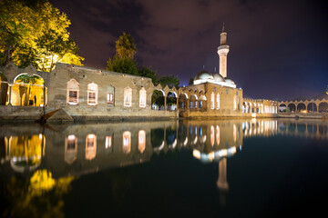 Night reflection of the Balikli Gol (Holy Pool of Prophet Abraham), located in the center of Urfa - Turkey. Mosque of Halil-ur-Rahman Reflection on Abraham's Pool Fish Lake © Artun