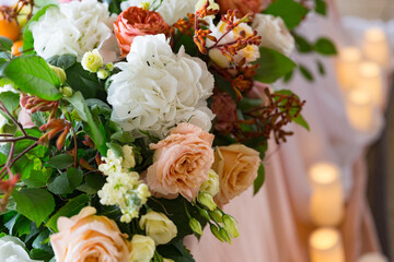 Beautiful wedding decoration in banqueting hall. candles, hydrangea, nude roses
