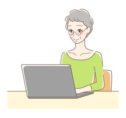 パソコンを操作して笑顔の女性