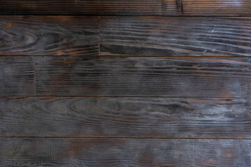 Fototapeta premium BBQ background. Burnt wooden Board texture. Burned scratched hardwood surface.
