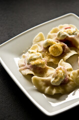 Plate of Polish strawberry dumplings in the kitchen.