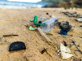 Fototapeta na wymiar Pollutants and plastic garbages on the beach