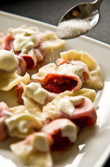 Plate of Polish strawberry dumplings in the kitchen.