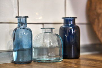 Kitchen decor. Wooden cutting Board and blue vases. Vessels. The dishes in the kitchen. Home accessories.