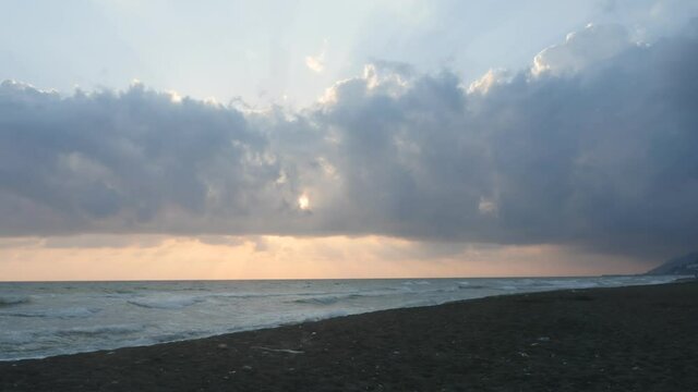 wavy sea and wind on a beach mountain background with clouds hatay samandag keldag turkey syria border