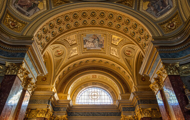 Fototapeta na wymiar Budapest, Hungary - Feb 8, 2020: Ceiling view with coat of arms window in Stephen's Basilica