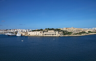 Fototapeta na wymiar The old warehouses and Fort Tigne on the point in Sliema, Malta