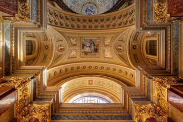 Fototapeta na wymiar Budapest, Hungary - Feb 8, 2020: Upward view of gildded golden ceiling fresco inside St. Stephen Basilica