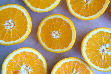 Orange Slices, half cut oranges on a marble background
