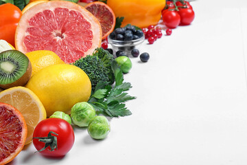Different products rich in vitamin C on white background