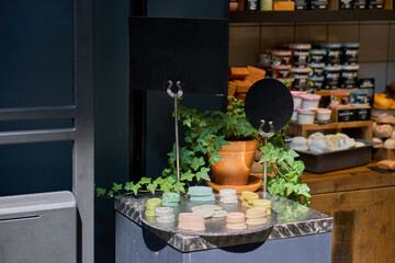 Shop for natural and organic cosmetics. A display of soap and desserts. information Desk. High quality photo