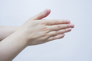 the cropped shot view of womans' hand using alcohol gel.