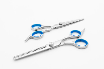 A set of hair scissors set hairdressing tools isolated on white background.