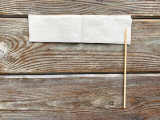 White napkin and skewer, children's creativity, ready to become a flower