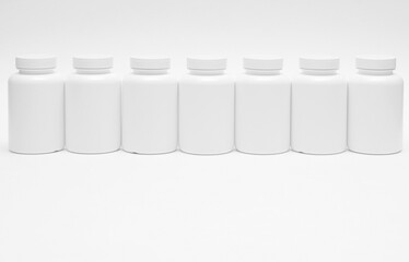 Seven white plastic containers for pills in a row isolated on white background
