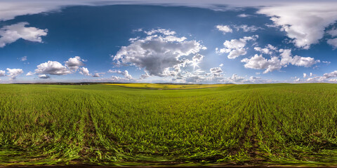 Fototapeta na wymiar full seamless spherical hdri panorama 360 degrees angle view among fields in summer day with awesome blue clouds in equirectangular projection, ready for VR AR virtual reality