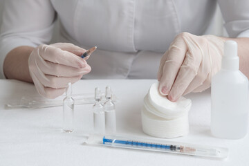 Before the doctor, everything necessary for inoculation and injection is laid out on the table....