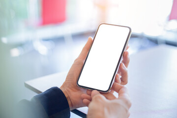 .cell phone Mockup image blank white screen.woman hand holding texting using mobile on desk at coffee shop.background empty space for advertise.work people contact marketing business,technology