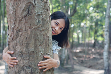 Asian women huging trees , the concept of love for the world    