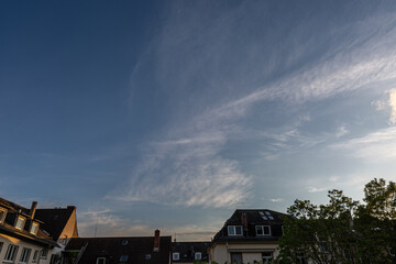 Sunset with dramatic sky over the roofs