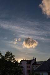 Sunset with dramatic sky over the roofs