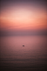 Lonely little boat under sunrise  - 353879101