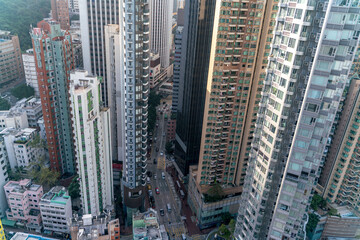 Fototapeta na wymiar The amazing view of Hong-Kong cityscape full of skyscrapers from the rooftop.
