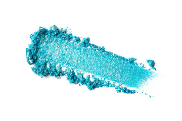 Close-up of make-up swatch. Smear of crushed shiny blue eye shadow