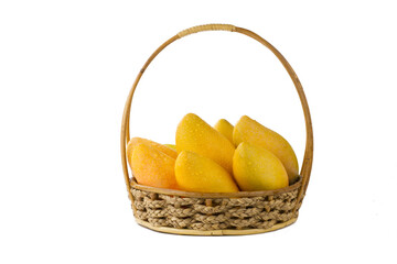 Ripe mango tropical fruit in basket isolated white background.