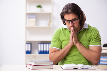 Young male student in the classroom